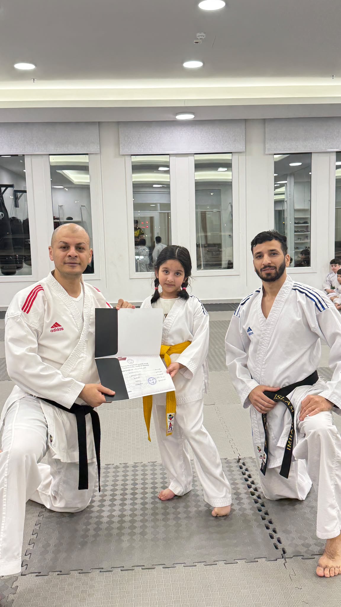Coaches presenting a grading certificate at Golden Lion