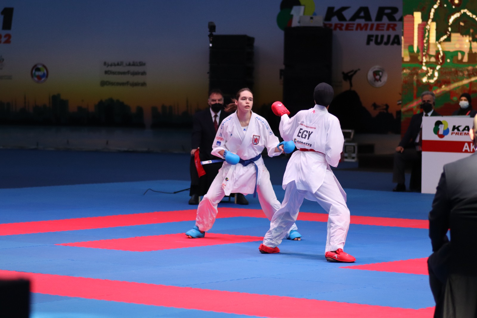 Athletes facing off under the flags of the world